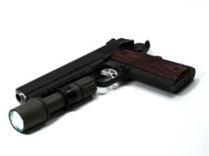 tactical flashlight on handgun