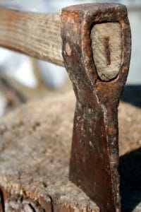 old hatchet stuck in stump