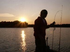 baiting fishing rod at night