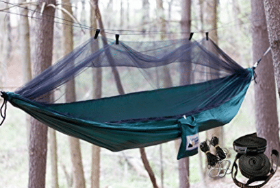 purple canopied hammock in woods