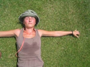 ana fernandez @ https://www.freeimages.com/photo/hot-hot-hot-1386833 resting woman hiker on grass