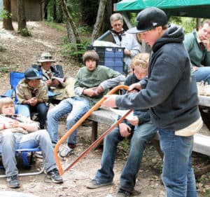 Richard Masoner @ https://www.flickr.com/photos/bike/5720656031/in/photolist-69Bniw-cYuqjw-cYupL5-cYuq4E-9HvRJx Boy scouts learning about bow saw at camp