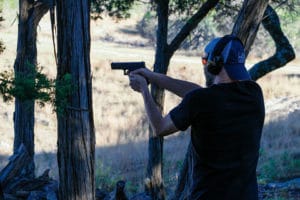 man shooting handgun