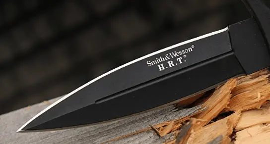 black bladed boot knife on wood