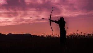 bow hunter at dusk